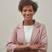 ebony williams, smiling woman wearing pink blazer